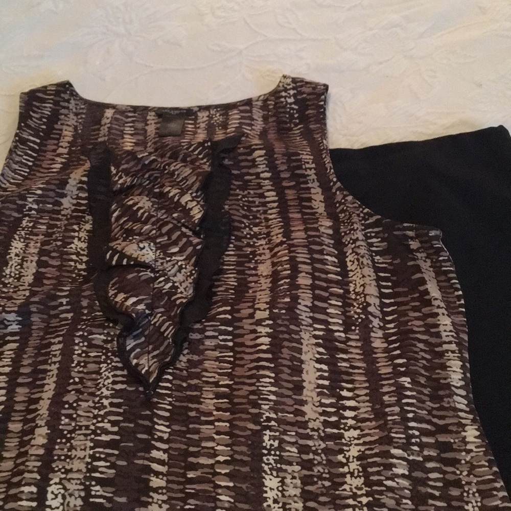 Ann Taylor sleeveless blouse with ruffle accent.